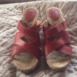 Lightly used sandals with a wedge.